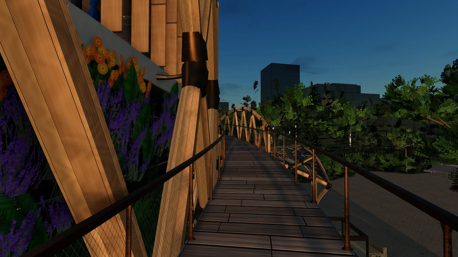 At sunset, a timber ramp with a mesh guard curves round the outside of the building toward the arched truss bridge over the entrance.