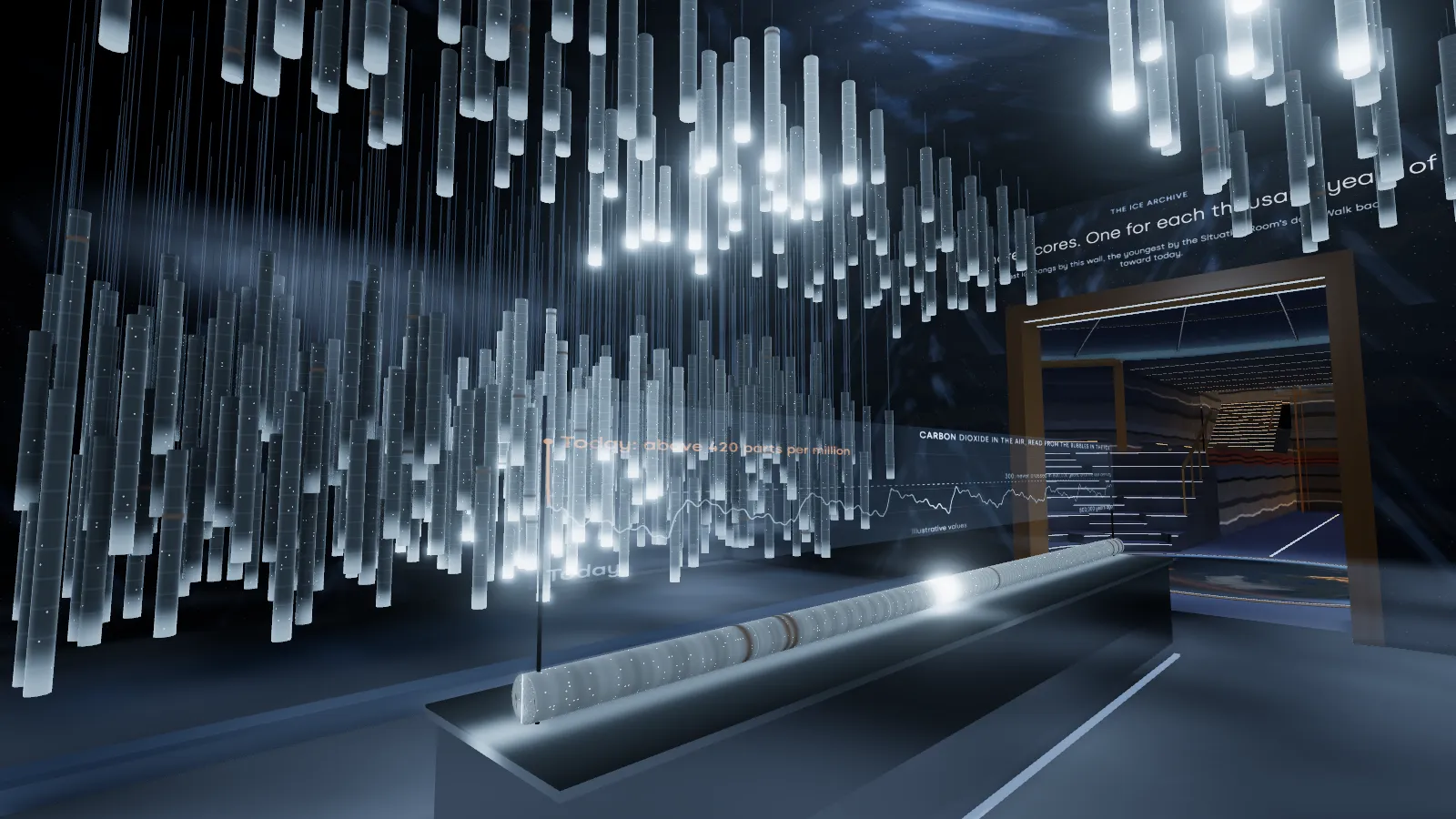 Hundreds of pale ice cores hanging in cold light over a long lit table that holds a single core, a line of carbon dioxide drawn on glass behind it.